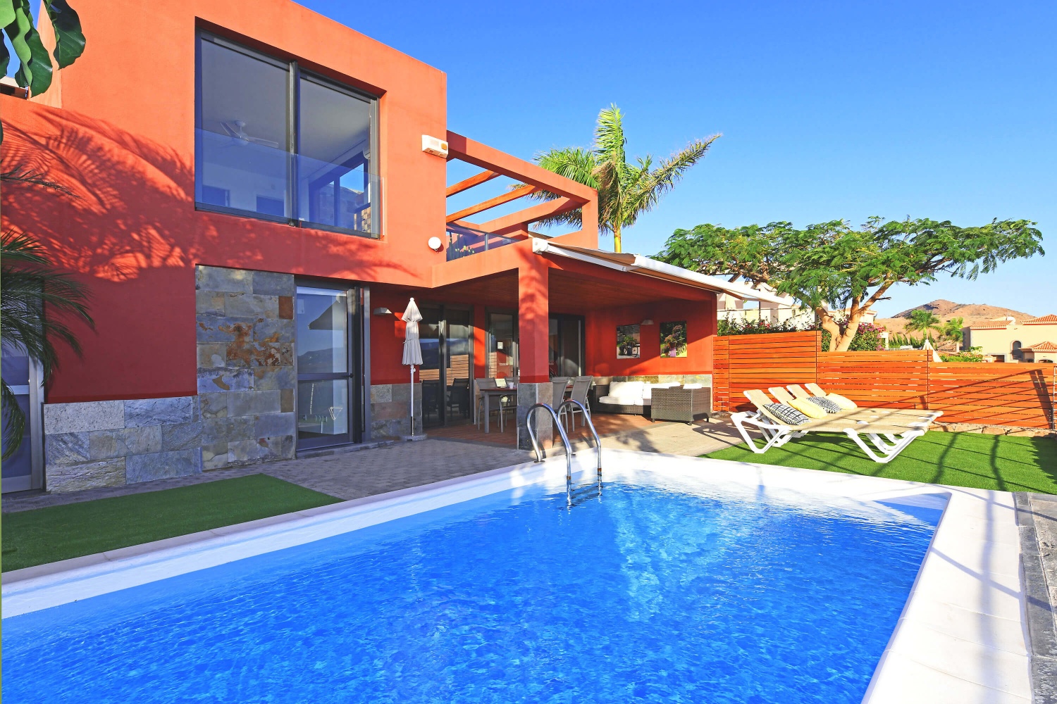 Modern two-bedroom home with stylish interiors, a great pool area and a terrace with panoramic views